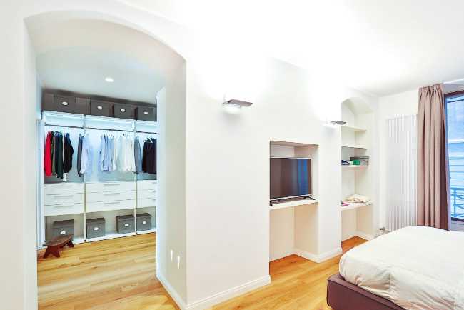 Bedroom with walk-in closet